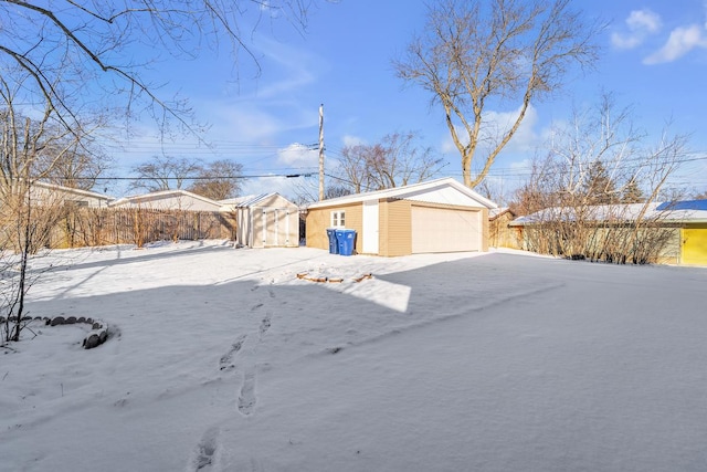 exterior space featuring a garage and a shed