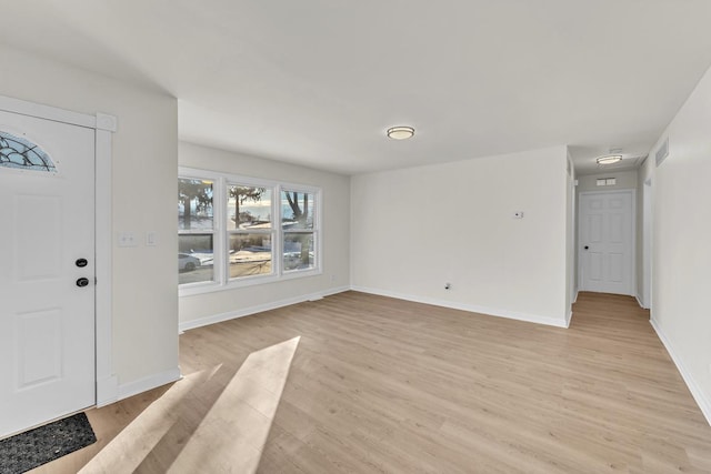 entrance foyer with light wood-type flooring