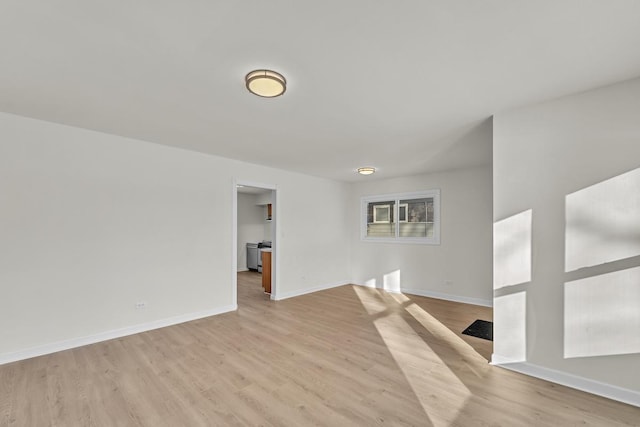 spare room featuring light hardwood / wood-style floors