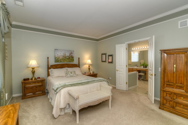 bedroom with crown molding, light colored carpet, and ensuite bath