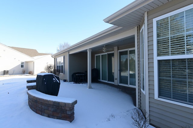 snow covered patio with ceiling fan