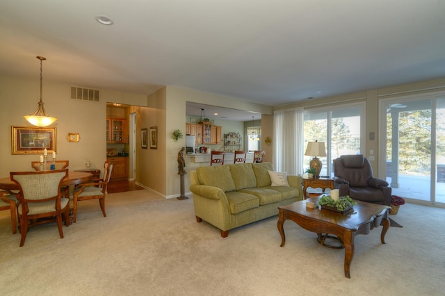 living room featuring light carpet