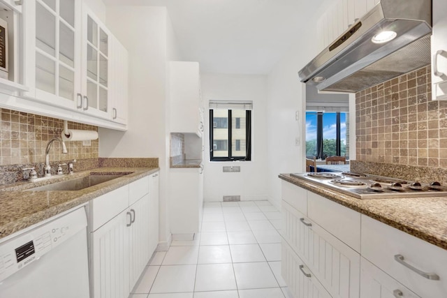 kitchen featuring sink, white cabinets, exhaust hood, gas cooktop, and white dishwasher