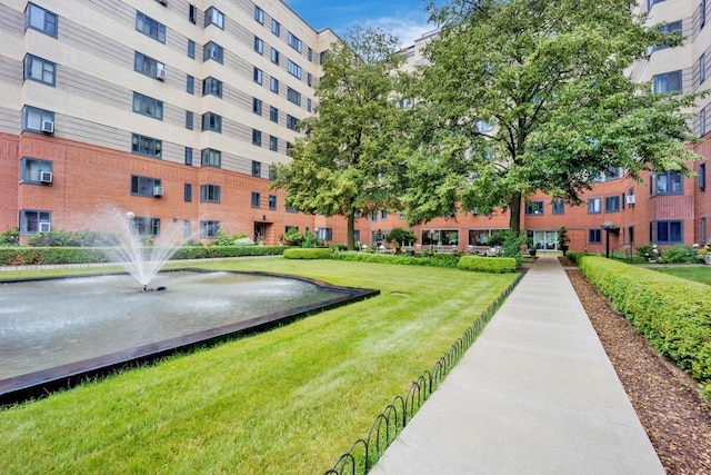 view of community featuring a lawn