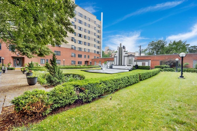 view of home's community featuring a lawn