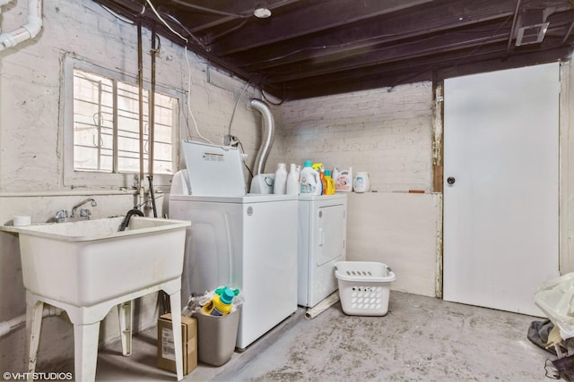 clothes washing area with washer and dryer