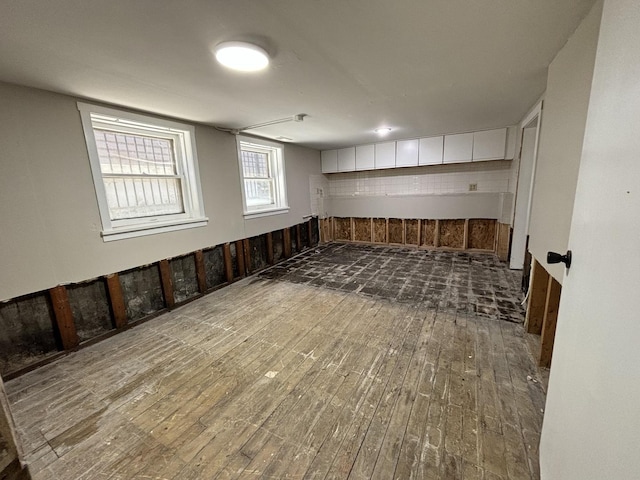 basement featuring hardwood / wood-style floors