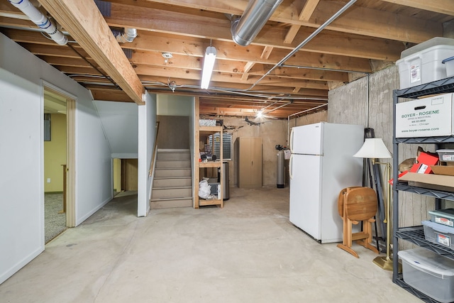 basement featuring white refrigerator