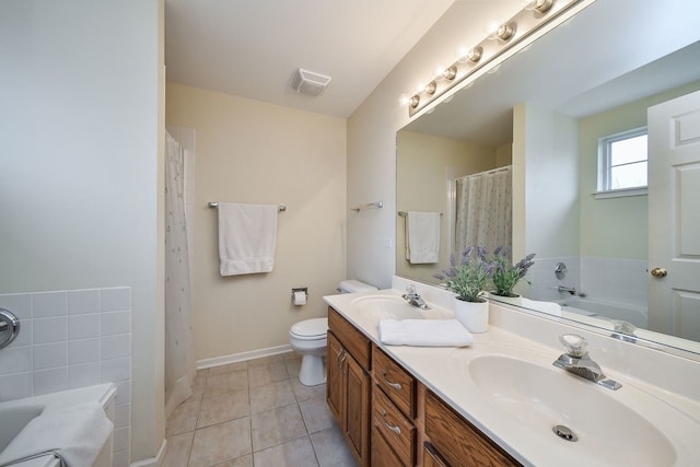 bathroom with a tub to relax in, toilet, tile patterned flooring, and vanity