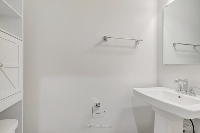 bathroom with sink and toilet