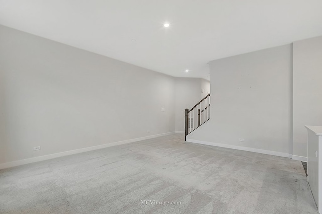 unfurnished room with light carpet