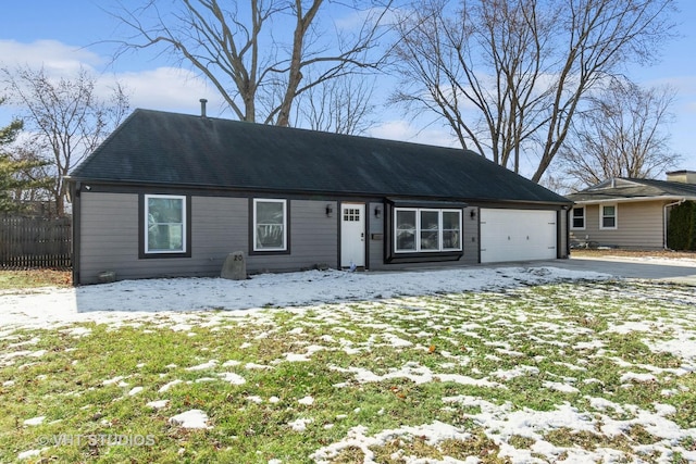 single story home featuring a garage