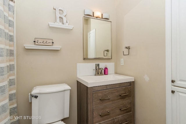 bathroom with vanity and toilet