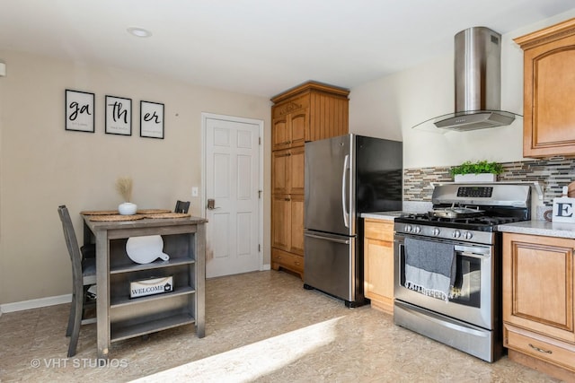 kitchen with appliances with stainless steel finishes, wall chimney range hood, and backsplash