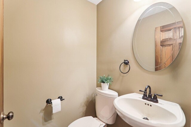 bathroom with sink and toilet