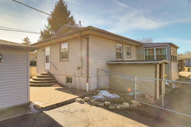 view of side of home featuring a patio area