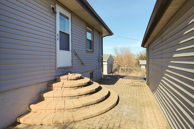 view of side of home with a patio