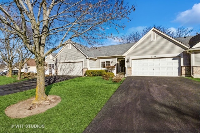 single story home featuring a garage and a front yard