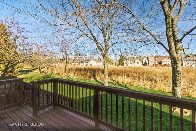 wooden deck with a yard