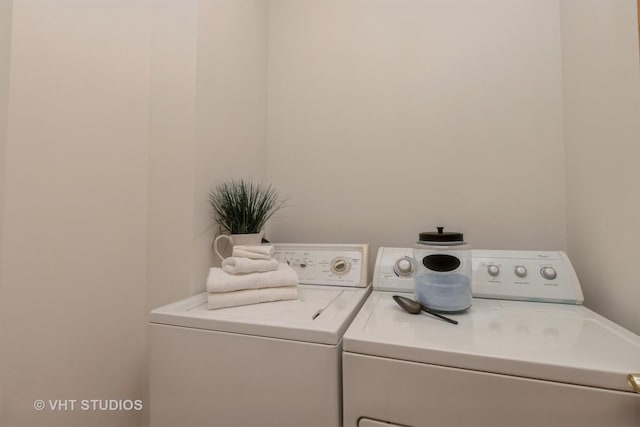 laundry area with independent washer and dryer