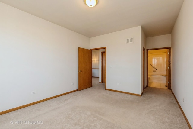 unfurnished bedroom with light colored carpet