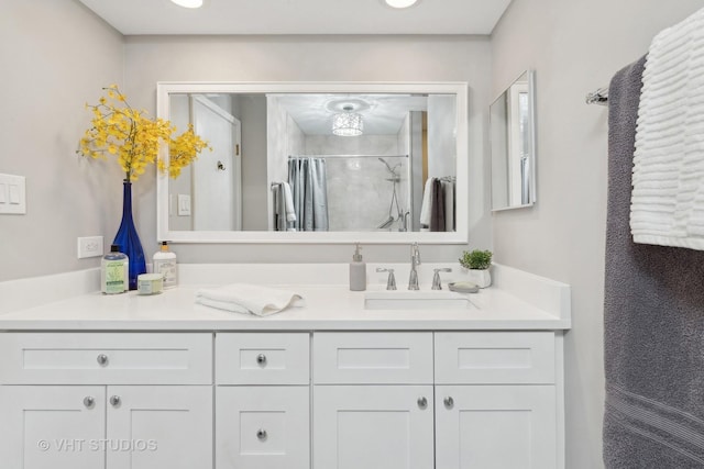 bathroom with a shower with curtain and vanity