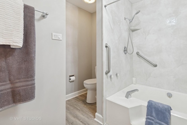 bathroom with wood-type flooring, bathing tub / shower combination, and toilet