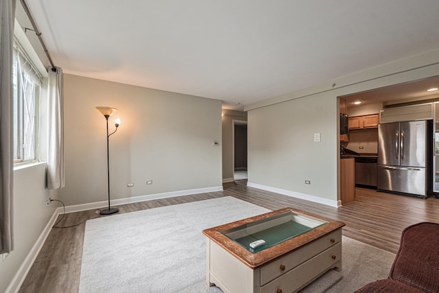 unfurnished living room featuring wood-type flooring