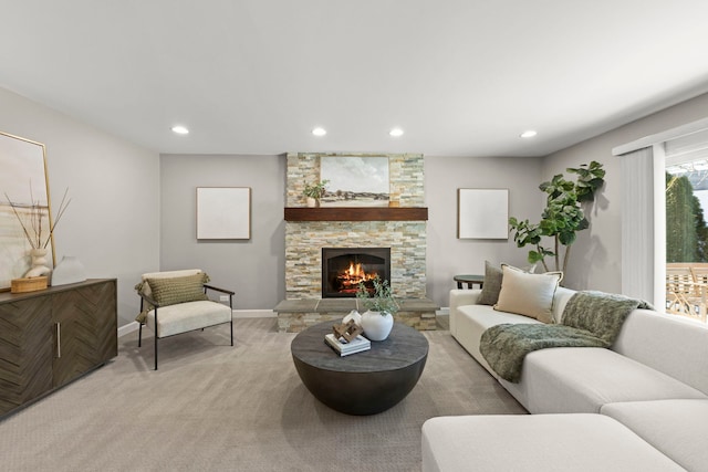 living room featuring a fireplace and light colored carpet