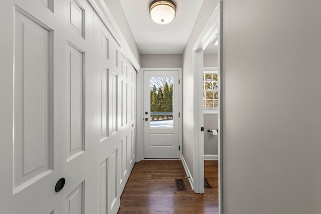 doorway with dark hardwood / wood-style flooring