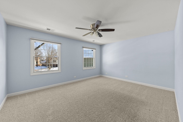 carpeted empty room with ceiling fan