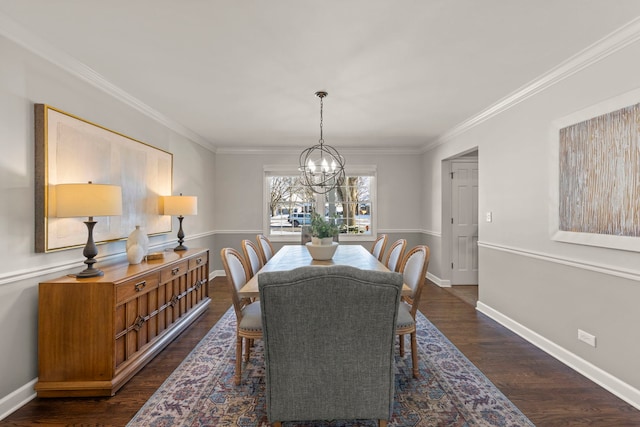 dining space with dark hardwood / wood-style flooring, crown molding, and an inviting chandelier