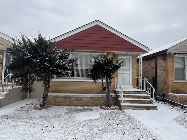 view of snow covered property entrance