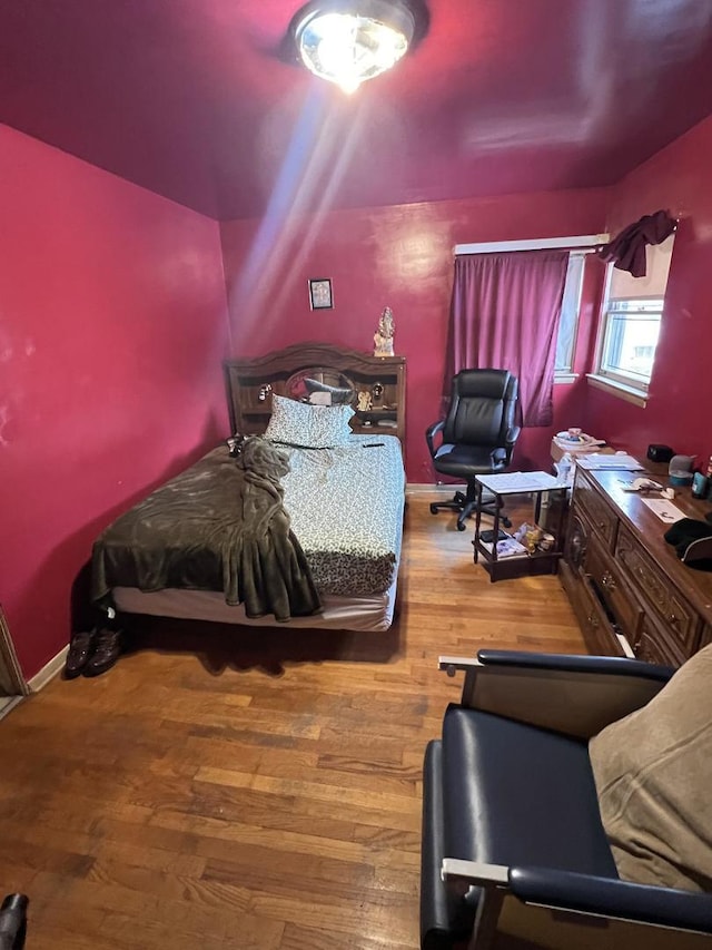 bedroom featuring hardwood / wood-style floors