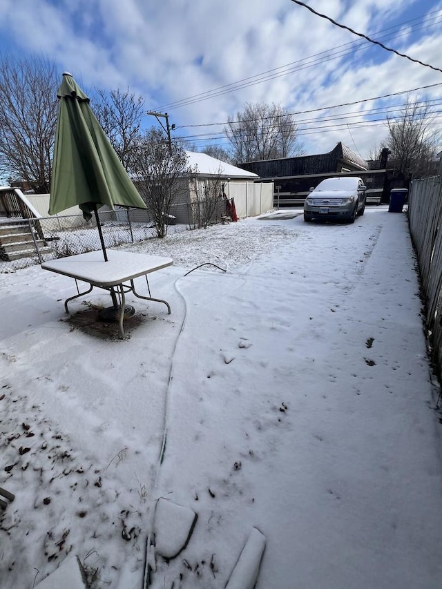 view of yard covered in snow