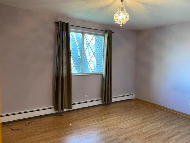 empty room with light wood-type flooring