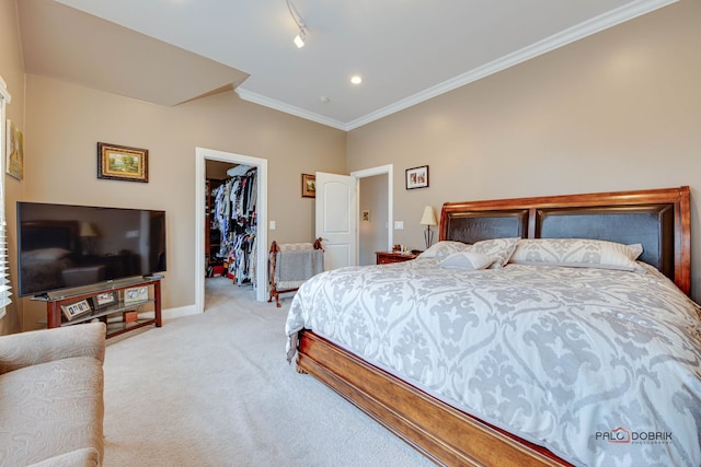 bedroom with crown molding, a walk in closet, light colored carpet, and a closet