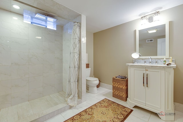 bathroom featuring vanity, toilet, and a shower with shower curtain