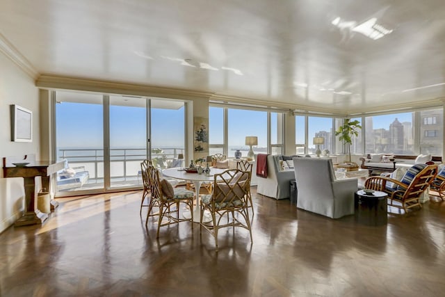 sunroom featuring a water view and plenty of natural light