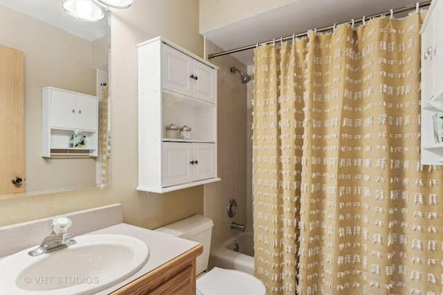 full bathroom featuring shower / bath combination with curtain, vanity, and toilet