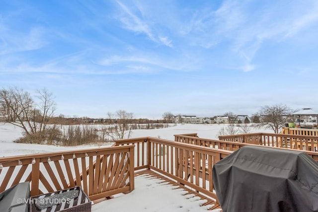 snow covered deck with area for grilling