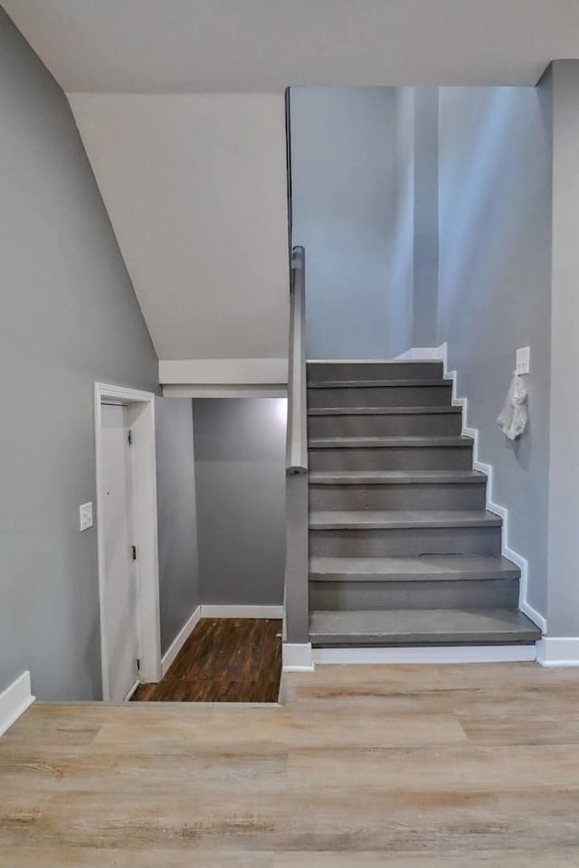 stairway featuring wood-type flooring