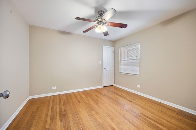 empty room featuring ceiling fan and light hardwood / wood-style flooring