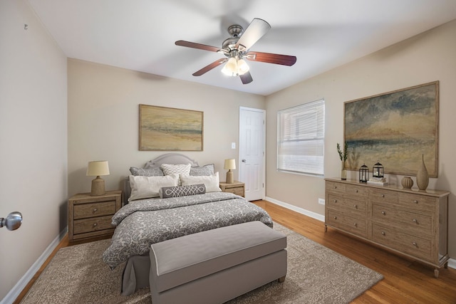 bedroom featuring hardwood / wood-style floors and ceiling fan