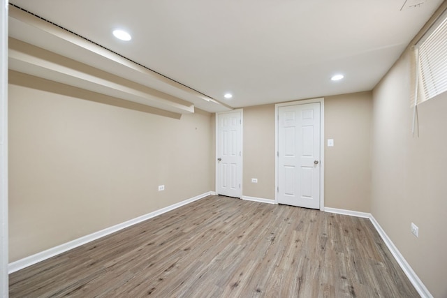 basement featuring light wood-type flooring