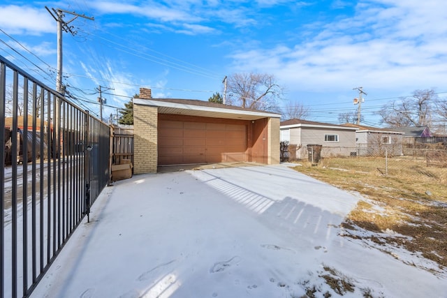 view of side of property featuring an outbuilding and a garage