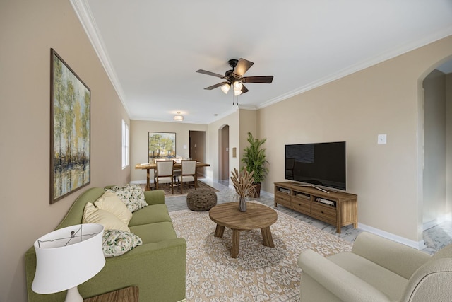 living room featuring crown molding and ceiling fan