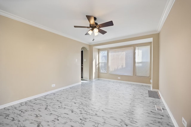 empty room featuring ornamental molding and ceiling fan