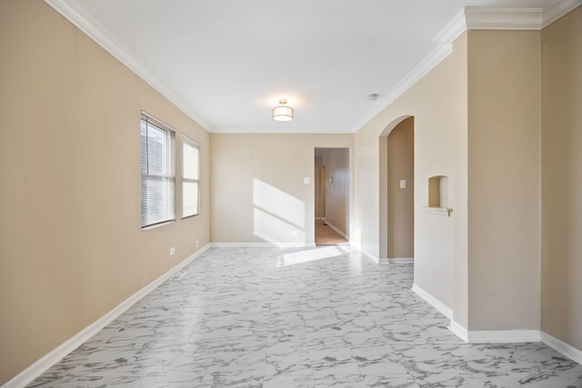 spare room with crown molding