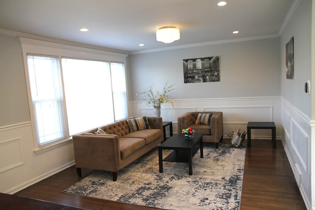 living room featuring a healthy amount of sunlight, ornamental molding, and dark hardwood / wood-style floors